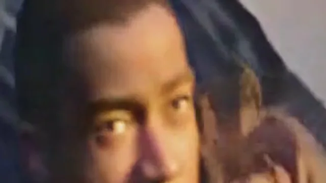 Fix pixelated video example, after: the same dark scene after restoration: the face after restoration, zoomed in