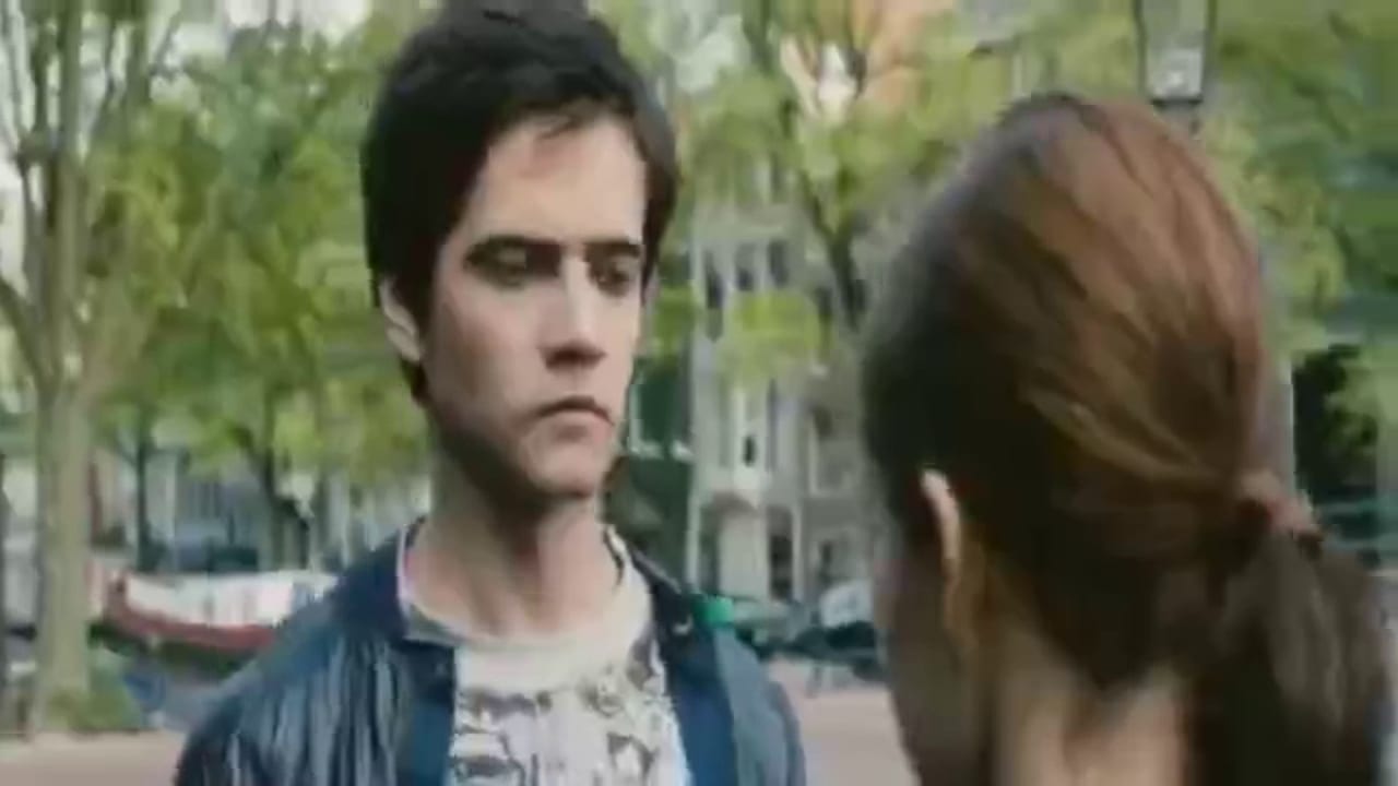 Fix pixelated video example, before: a young man and a woman on an Amsterdam canal street, smeared and blocky before the fix